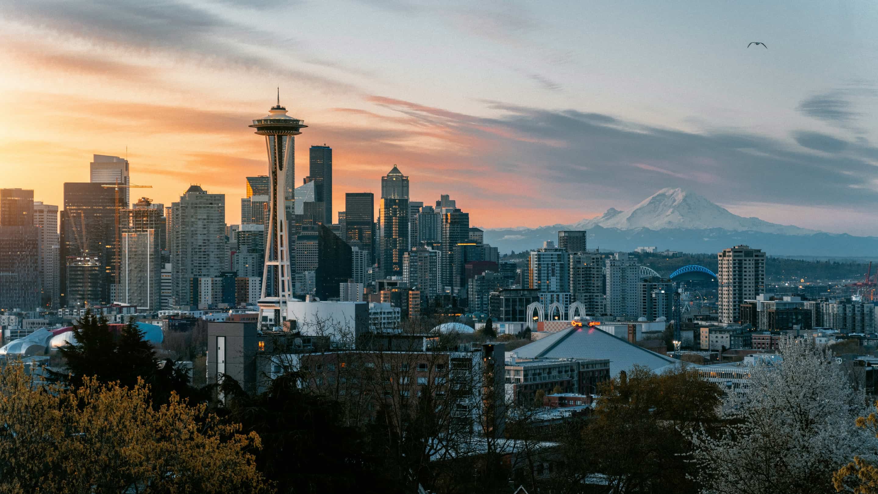Seattle skyline at sunset with the Space Needle and Mount Rainier — host city for the FIFA World Cup 2026 matches at Lumen Field